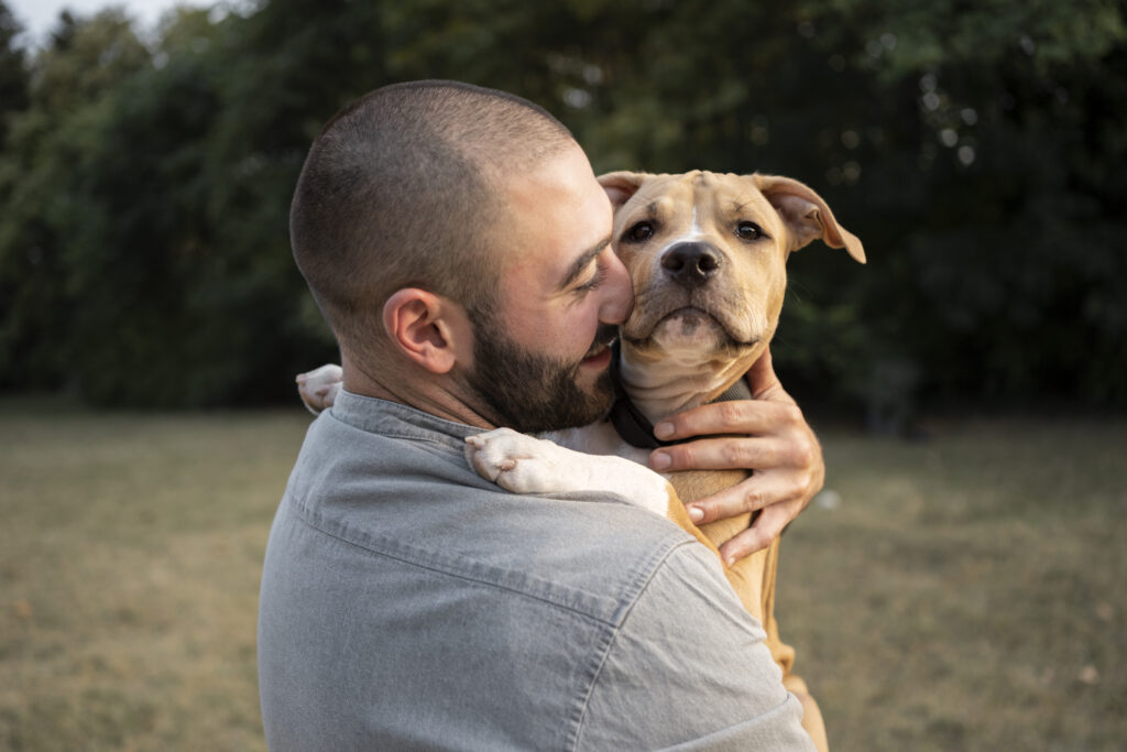 Man hugging his dog, highlighting the emotional bond essential for training a psychiatric service dog.