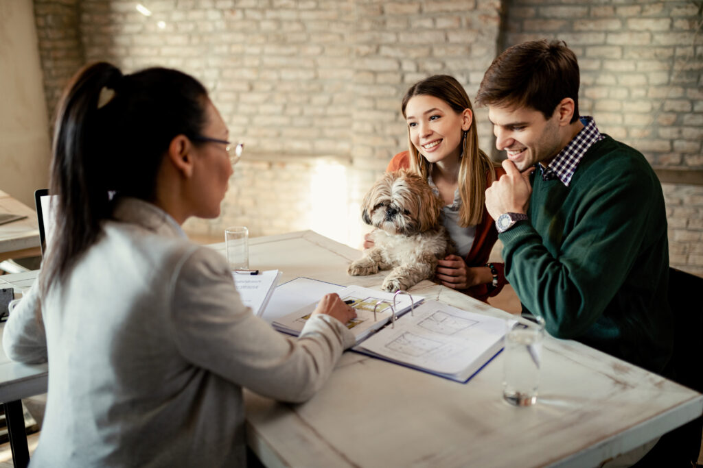 Fair Housing and Emotional Support Animals: Tenant and landlord discussing ESA accommodation with a dog.