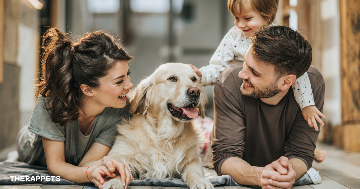 Why Pets Make Us Happier: A family enjoying time with their pet dog, showcasing the joy and happiness pets bring to our lives.